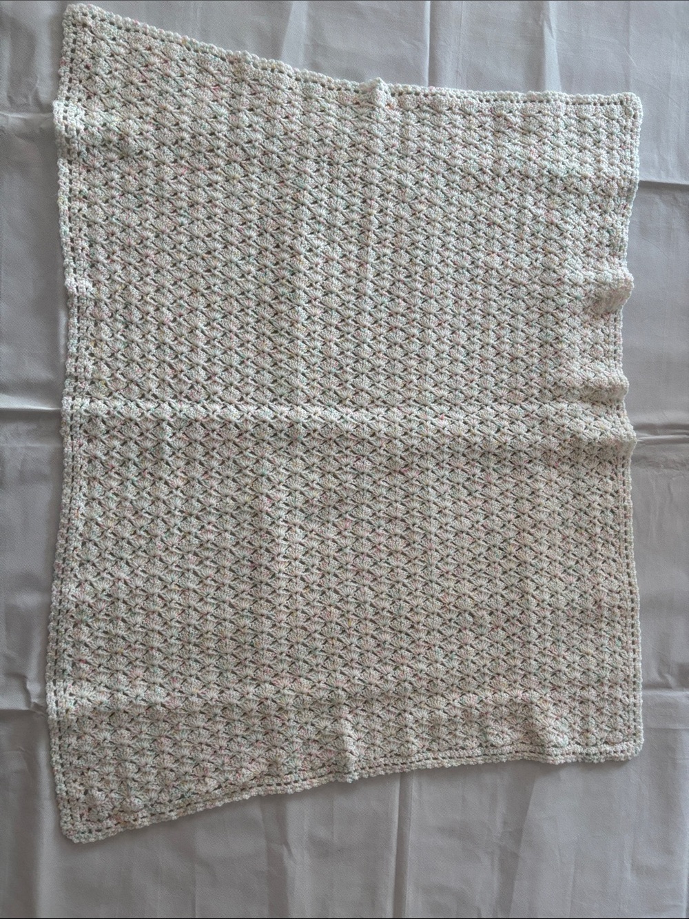 Soft White Crochet Baby Blanket with Pastel Accents